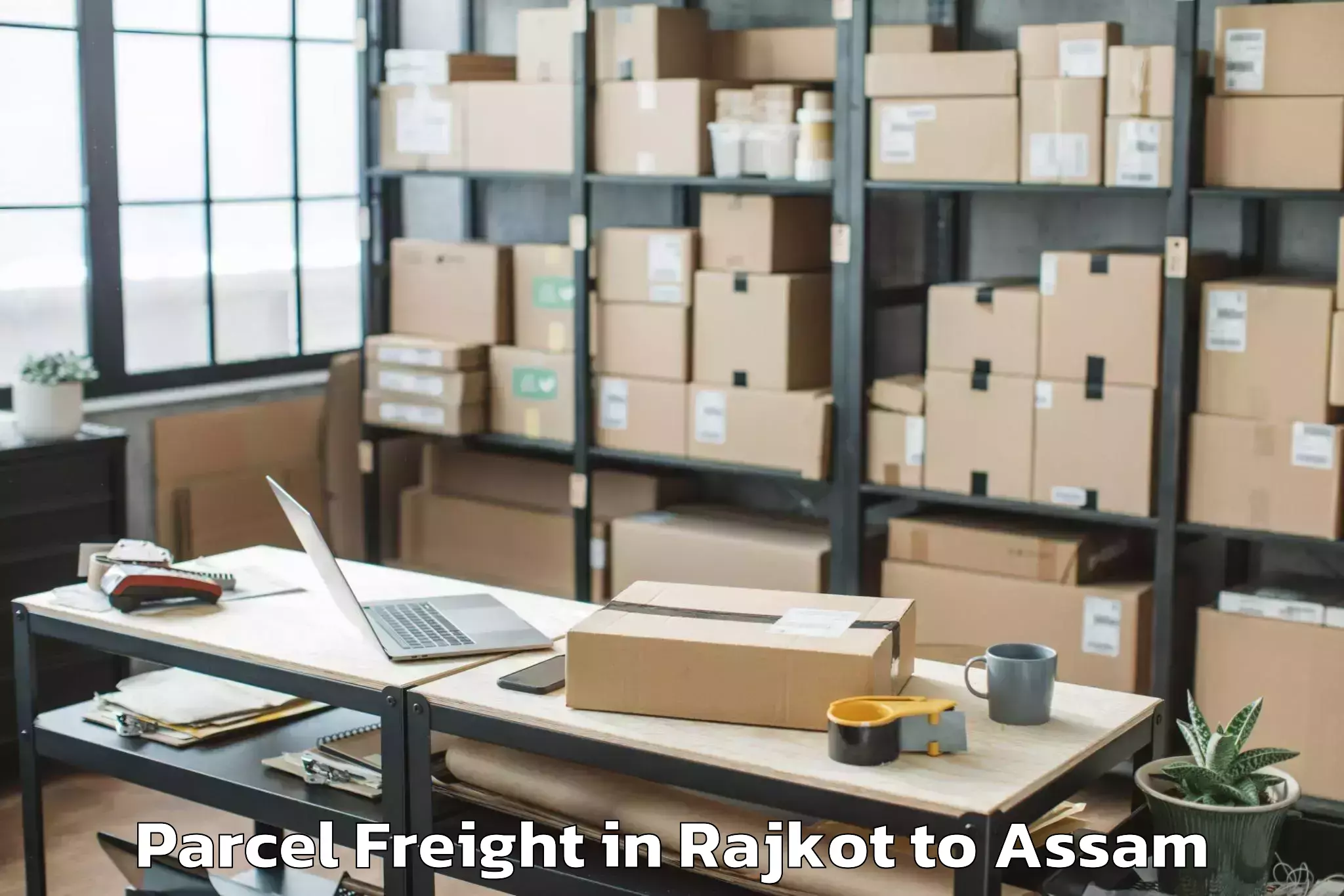 Rajkot to Kharupatia Parcel Freight Booking